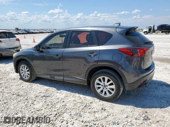 ✅ 2014 Mazda CX-5 Sport • VIN: JM3KE2BE5E0386119 • Lot: 68226855. Listed on Copart with 310,877 mi. Free auction sales archive from the USA and detailed vehicle history report at DreamBid. Image 2.