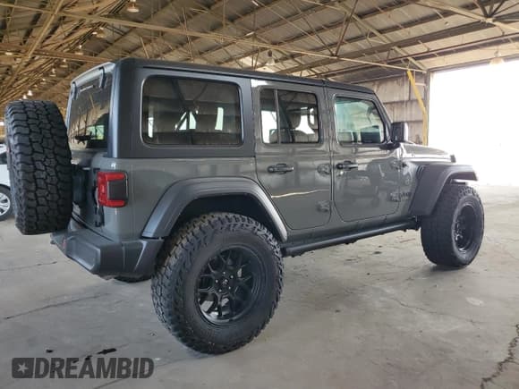 ✅ 2022 Jeep Wrangler Unlimited High Tide • VIN: 1C4HJXDG2NW221829 • Lot: 64836074. Listed on Copart with 3,394 mi. Free auction sales archive from the USA and detailed vehicle history report at DreamBid. Image 3.