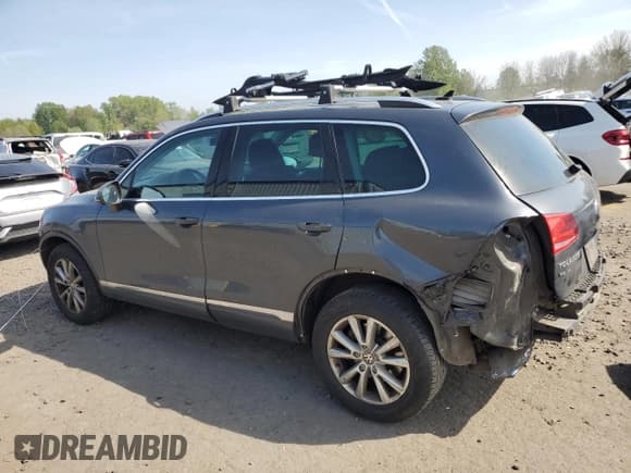 ✅ 2013 Volkswagen Touareg Exec • VIN: WVGEF9BP2DD000126 • Lot: 54430375. Listed on Copart with 111,677 mi. Free auction sales archive from the USA and detailed vehicle history report at DreamBid. Image 2.