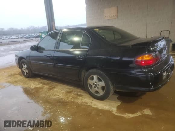 2003 Chevrolet Malibu LS with VIN 1G1NE52J93M566285, listed as a Copart auction lot 86095424 with 176,209 mi miles and Salvage title. Bid and sale history available at DreamBid. Image 2.