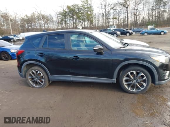 ✅ 2016 Mazda CX-5 Grand Touring • VIN: JM3KE4DY8G0834567 • Lot: 43837311. Wystawiony na IAAI z przebiegiem Nie podano. Bezpłatny archiwum sprzedaży aukcyjnych z USA i szczegółowy raport historii pojazdu na DreamBid. Zdjęcie 12.