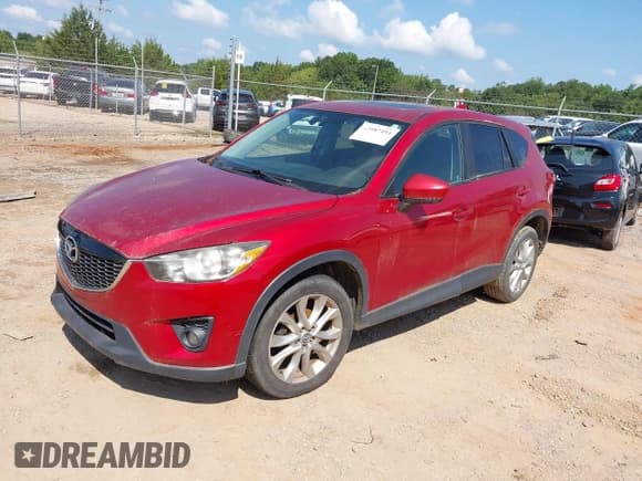 ✅ 2014 Mazda CX-5 Grand Touring • VIN: JM3KE4DY9E0422204 • Лот: 42987494. Опубликован ранее на IAAI с пробегом 136 190 миль. Бесплатный доступ к архиву аукционных продаж из США и подробный отчёт об истории автомобиля на DreamBid. Изображение 2.