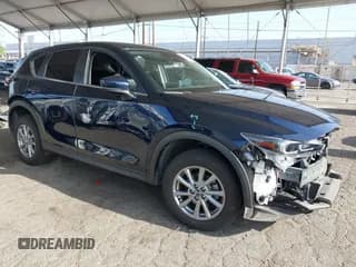 ✅ 2022 Mazda CX-5 S Preferred • VIN: JM3KFBCM2N0600356 • Lot: 42533914. Listed on IAAI with 31,172 mi. Free auction sales archive from the USA and detailed vehicle history report at DreamBid. Image 1.