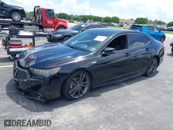 ✅ 2018 Acura TLX w/A-SPEC Pkg • VIN: 19UUB2F65JA002553 • Lot: 40023121. Listed on IAAI with 123,259 mi. Free auction sales archive from the USA and detailed vehicle history report at DreamBid. Image 2.