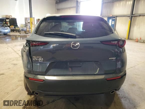 ✅ 2024 Mazda CX-30 S Carbon Edition • VIN: 3MVDMBCM9RM603585 • Лот: 84959225. Опубликован ранее на Copart с пробегом 23 499 миль. Бесплатный доступ к архиву аукционных продаж из США и подробный отчёт об истории автомобиля на DreamBid. Изображение 6.