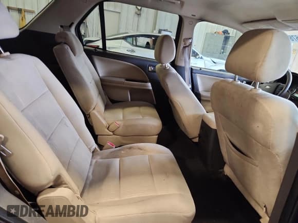 ✅ 2009 Ford Taurus X SEL • VIN: 1FMDK02WX9GA03971 • Lot: 86678015. Listed on Copart with 214,728 mi. Free auction sales archive from the USA and detailed vehicle history report at DreamBid. Image 11.