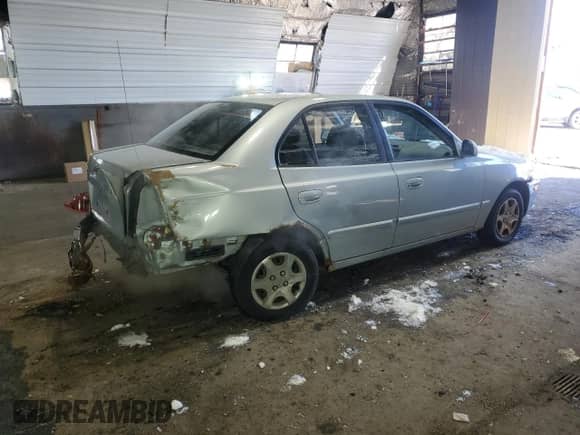 2005 Hyundai Accent GLS z VIN KMHCG45C15U602419, wystawiony jako Copart lot #47759675 z przebiegiem 58 133 mil mil oraz Szkoda całkowita • Salvage title. Historia ofert i sprzedaży dostępna na DreamBid. Obrazek 3.