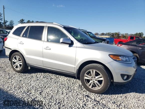 ✅ 2012 Hyundai Santa Fe SE • VIN: 5XYZHDAG2CG145428 • Lot: 81672604. Listed on Copart with 89,987 mi. Free auction sales archive from the USA and detailed vehicle history report at DreamBid. Image 4.