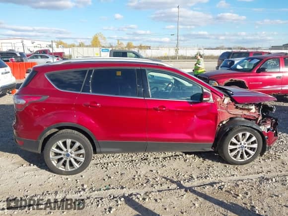 2017 Ford Escape Titanium z VIN 1FMCU9J94HUA64108, wystawiony jako IAAI lot #43571909 z przebiegiem 209 412 mil mil oraz . Historia ofert i sprzedaży dostępna na DreamBid. Obrazek 14.