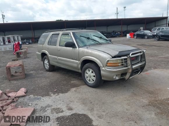 ✅ 1999 GMC Jimmy SLT • VIN: 1GKDT13W7X2952091 • Lot: 42828585. Listed on IAAI with 168,146 mi. Free auction sales archive from the USA and detailed vehicle history report at DreamBid. Image 1.