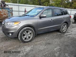 2012 Hyundai Santa Fe SE z VIN 5XYZHDAGXCG140591, wystawiony jako Copart lot #81574875 z przebiegiem 168 780 mil mil oraz Szkoda całkowita • Salvage title. Historia ofert i sprzedaży dostępna na DreamBid. Obrazek 1.
