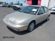 ✅ 1999 Saturn SL • VIN: 1G8ZK5275XZ283178 • Lot: 42303549. Wystawiony na IAAI z przebiegiem 216 776 mil. Bezpłatny archiwum sprzedaży aukcyjnych z USA i szczegółowy raport historii pojazdu na DreamBid. Zdjęcie 2.