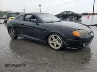 2004 Hyundai Tiburon GT с VIN KMHHN65F04U116247, выставлен на аукционе Copart как лот 64578955 с пробегом 238 388 миль миль и Списание • Salvage title. История ставок и продаж доступна на DreamBid. Изображение 4.
