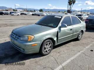 2004 Hyundai Accent GL z VIN KMHCG45C44U533952, wystawiony jako Copart lot #51181095 z przebiegiem 88 446 mil mil oraz Szkoda całkowita • Salvage title. Historia ofert i sprzedaży dostępna na DreamBid. Obrazek 1.