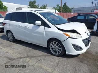 ✅ 2012 Mazda 5 Touring • VIN: JM1CW2CL2C0125776 • Lot: 42496258. Listed on IAAI with 130,522 mi. Free auction sales archive from the USA and detailed vehicle history report at DreamBid. Image 1.