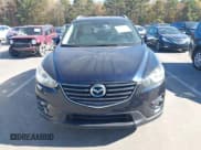 ✅ 2016 Mazda CX-5 Grand Touring • VIN: JM3KE2DY5G0715623 • Lot: 43582561. Wystawiony na IAAI z przebiegiem 166 935 mil. Bezpłatny archiwum sprzedaży aukcyjnych z USA i szczegółowy raport historii pojazdu na DreamBid. Zdjęcie 12.