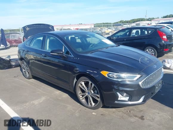 ✅ 2019 Ford Fusion Titanium • VIN: 3FA6P0D98KR137890 • Lot: 43066104. Listed on IAAI with 122,462 mi. Free auction sales archive from the USA and detailed vehicle history report at DreamBid. Image 1.