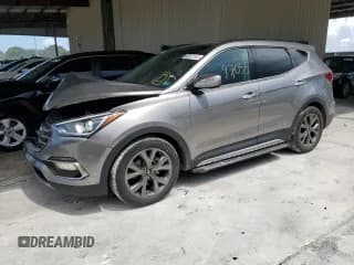 ✅ 2017 Hyundai Santa Fe Ultimate • VIN: 5XYZWDLA4HG489199 • Лот: 63521243. Опубликован ранее на Copart с пробегом 97 055 миль. Бесплатный доступ к архиву аукционных продаж из США и подробный отчёт об истории автомобиля на DreamBid. Изображение 1.