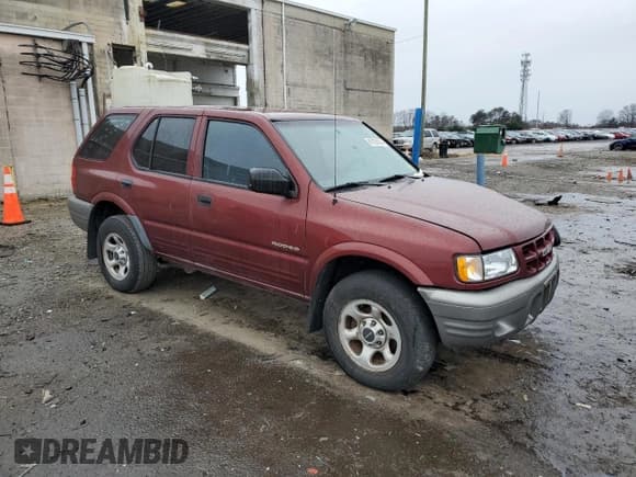 ✅ 2002 Isuzu Rodeo • VIN: 4S2CK58D124323937 • Lot: 86155194. Listed on Copart with 184,491 mi. Free auction sales archive from the USA and detailed vehicle history report at DreamBid. Image 4.