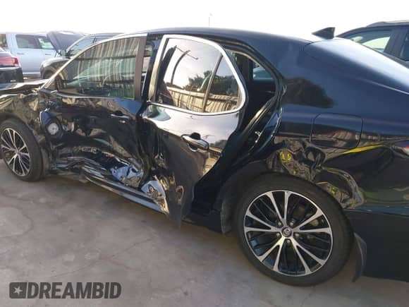 2019 Toyota Camry LE with VIN 4T1B11HK2KU833243, listed as a IAAI auction lot 42855313 with 128,404 mi miles and . Bid and sale history available at DreamBid. Image 17.