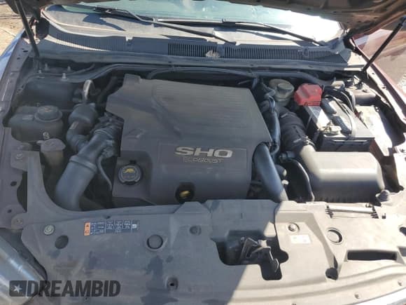 ✅ 2016 Ford Taurus SHO • VIN: 1FAHP2KT6GG140921 • Lot: 52118935. Listed on Copart with 132,199 mi. Free auction sales archive from the USA and detailed vehicle history report at DreamBid. Image 11.