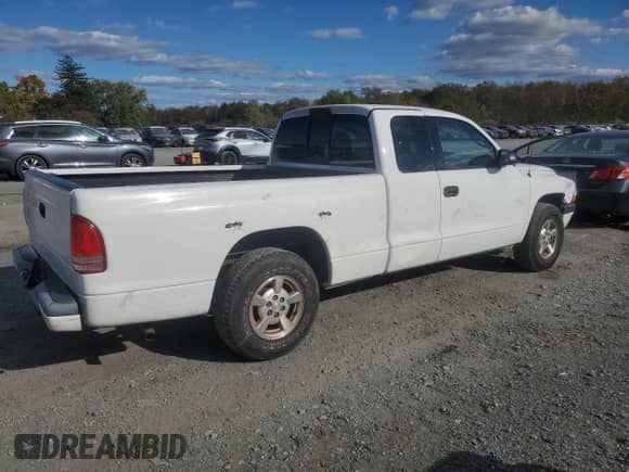 2001 Dodge Dakota z VIN 1B7GL22X21S162973, wystawiony jako Copart lot #76419754 z przebiegiem 135 707 mil mil oraz Czysty tytuł • Clean title. Historia ofert i sprzedaży dostępna na DreamBid. Obrazek 3.