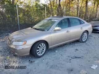 2006 Hyundai Azera SE z VIN KMHFC46F36A049549, wystawiony jako Copart lot #75206174 z przebiegiem 82 617 mil mil oraz Szkoda całkowita • Salvage title. Historia ofert i sprzedaży dostępna na DreamBid. Obrazek 1.