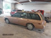 ✅ 1994 Ford Escort • VIN: 1FARP15J3RW212935 • Lot: 42595461. Listed on IAAI with 90,056 mi. Free auction sales archive from the USA and detailed vehicle history report at DreamBid. Image 3.