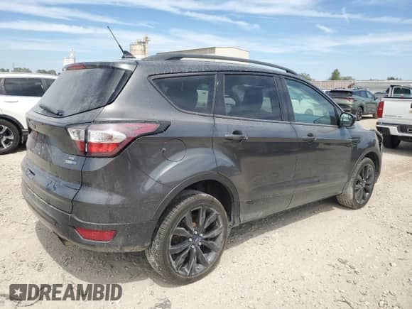 2018 Ford Escape SE z VIN 1FMCU9GD6JUD48647, wystawiony jako Copart lot #70868345 z przebiegiem 102 072 mil mil oraz Szkoda całkowita • Salvage title. Historia ofert i sprzedaży dostępna na DreamBid. Obrazek 3.