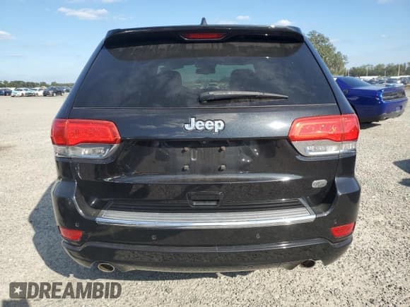 ✅ 2014 Jeep Grand Cherokee Overland • VIN: 1C4RJECG1EC574350 • Lot: 90257825. Listed on Copart with 116,195 mi. Free auction sales archive from the USA and detailed vehicle history report at DreamBid. Image 6.