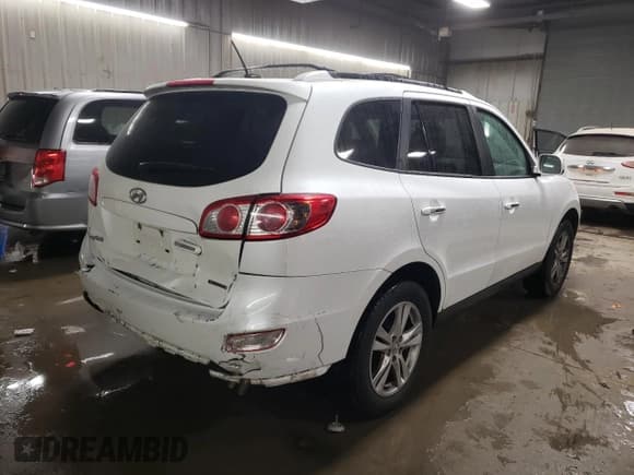 ✅ 2012 Hyundai Santa Fe Limited • VIN: 5XYZKDAG6CG110098 • Lot: 84957014. Listed on Copart with 133,418 mi. Free auction sales archive from the USA and detailed vehicle history report at DreamBid. Image 3.