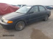✅ 1997 Mazda Protege DX • VIN: JM1BC1418V0165780 • Lot: 42735711. Wystawiony na IAAI z przebiegiem 65 652 mil. Bezpłatny archiwum sprzedaży aukcyjnych z USA i szczegółowy raport historii pojazdu na DreamBid. Zdjęcie 2.