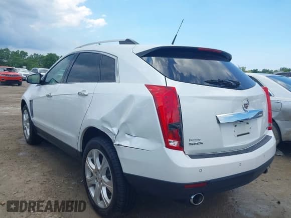 ✅ 2014 Cadillac SRX Performance Collection • VIN: 3GYFNCE35ES561742 • Lot: 42579887. Listed on IAAI with 95,009 mi. Free auction sales archive from the USA and detailed vehicle history report at DreamBid. Image 3.