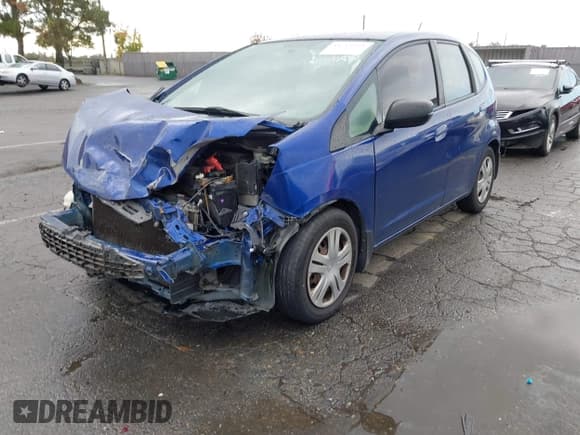 ✅ 2009 Honda Fit • VIN: JHMGE88229C003674 • Lot: 43714999. Listed on IAAI with 229,955 mi. Free auction sales archive from the USA and detailed vehicle history report at DreamBid. Image 2.