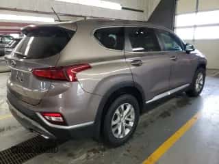 2019 Hyundai Santa Fe SE z VIN 5NMS2CAD4KH092982, wystawiony jako Copart lot #70875062 z przebiegiem 107 862 mil mil oraz . Historia ofert i sprzedaży dostępna na DreamBid. Obrazek 3.