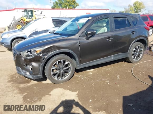 ✅ 2016 Mazda CX-5 Grand Touring • VIN: JM3KE4DY6G0742535 • Lot: 43402645. Wystawiony na IAAI z przebiegiem 130 732 mil. Bezpłatny archiwum sprzedaży aukcyjnych z USA i szczegółowy raport historii pojazdu na DreamBid. Zdjęcie 2.