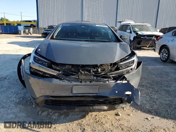 2025 Toyota Prius LE с VIN JTDACAAUXS3057231, выставлен на аукционе Copart как лот 70268475 с пробегом 4 902 миль миль и Списание • Salvage title. История ставок и продаж доступна на DreamBid. Изображение 5.