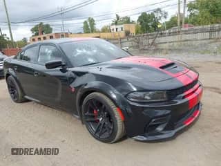 2022 Dodge Charger SRT Hellcat Widebody z VIN 2C3CDXL99NH199819, wystawiony jako IAAI lot #43450586 z przebiegiem 21 491 mil mil oraz . Historia ofert i sprzedaży dostępna na DreamBid. Obrazek 1.