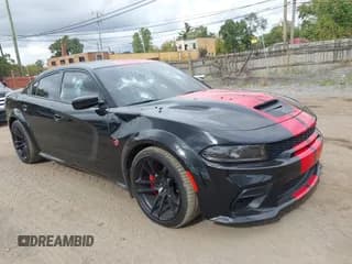 ✅ 2022 Dodge Charger SRT Hellcat Widebody • VIN: 2C3CDXL99NH199819 • Lot: 43450586. Wystawiony na IAAI z przebiegiem 21 491 mil. Bezpłatny archiwum sprzedaży aukcyjnych z USA i szczegółowy raport historii pojazdu na DreamBid. Zdjęcie 1.