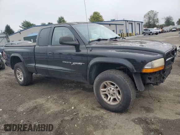 2001 Dodge Dakota Sport z VIN 1B7GG22N01S129747, wystawiony jako Copart lot #74132454 z przebiegiem 180 890 mil mil oraz Szkoda całkowita • Salvage title. Historia ofert i sprzedaży dostępna na DreamBid. Obrazek 4.