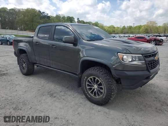 ✅ 2018 Chevrolet Colorado 4WD ZR2 • VIN: 1GCPTEE11J1194070 • Lot: 52037025. Listed on Copart with 104,858 mi. Free auction sales archive from the USA and detailed vehicle history report at DreamBid. Image 4.