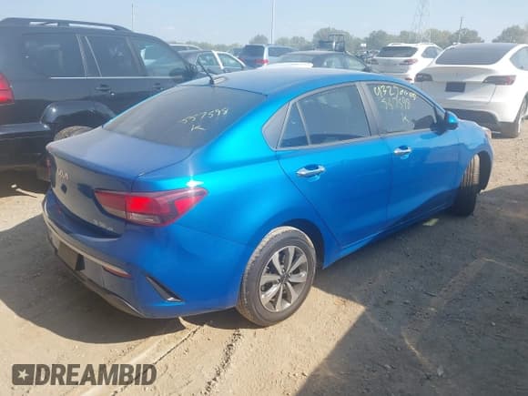 ✅ 2023 Kia Rio S • VIN: 3KPA24AD6PE557598 • Lot: 43250605. Listed on IAAI with 33,426 mi. Free auction sales archive from the USA and detailed vehicle history report at DreamBid. Image 4.