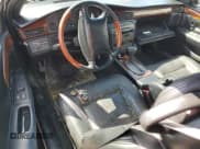 ✅ 2002 Cadillac Eldorado Touring • VIN: 1G6ET12912B102383 • Лот: 75119604. Опубликован ранее на Copart с пробегом Не указан. Бесплатный доступ к архиву аукционных продаж из США и подробный отчёт об истории автомобиля на DreamBid. Изображение 8.