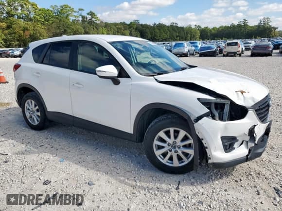 ✅ 2016 Mazda CX-5 Touring • VIN: JM3KE2CY2G0607428 • Лот: 91684385. Опубликован ранее на Copart с пробегом 130 111 миль. Бесплатный доступ к архиву аукционных продаж из США и подробный отчёт об истории автомобиля на DreamBid. Изображение 4.