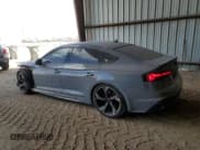 ✅ 2023 Audi RS 5 Sportback • VIN: WUAAWCF57PA903163 • Лот: 77034994. Опубликован ранее на Copart с пробегом 13 115 миль. Бесплатный доступ к архиву аукционных продаж из США и подробный отчёт об истории автомобиля на DreamBid. Изображение 2.