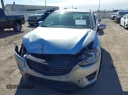 ✅ 2016 Mazda CX-5 Sport • VIN: JM3KE2BE9G0915168 • Lot: 41482749. Wystawiony na IAAI z przebiegiem 86 802 mil. Bezpłatny archiwum sprzedaży aukcyjnych z USA i szczegółowy raport historii pojazdu na DreamBid. Zdjęcie 6.