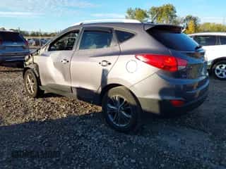 2015 Hyundai Tucson SE with VIN KM8JU3AGXFU050794, listed as a IAAI auction lot 43440138 with 161,385 mi miles and . Bid and sale history available at DreamBid. Image 3.