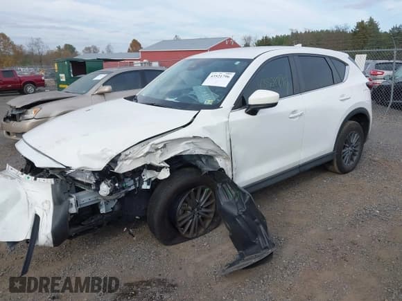 ✅ 2021 Mazda CX-5 Touring • VIN: JM3KFBCM8M0417025 • Lot: 43521796. Wystawiony na IAAI z przebiegiem 44 218 mil. Bezpłatny archiwum sprzedaży aukcyjnych z USA i szczegółowy raport historii pojazdu na DreamBid. Zdjęcie 2.
