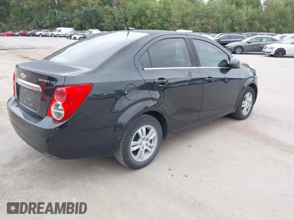 ✅ 2014 Chevrolet Sonic LT • VIN: 1G1JC5SH0E4193772 • Lot: 43435827. Listed on IAAI with 122,088 mi. Free auction sales archive from the USA and detailed vehicle history report at DreamBid. Image 4.