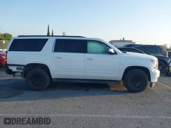 2018 Chevrolet Suburban LS z VIN 1GNSKGKC5JR173889, wystawiony jako IAAI lot #42152865 z przebiegiem 73 358 mil mil oraz . Historia ofert i sprzedaży dostępna na DreamBid. Obrazek 13.